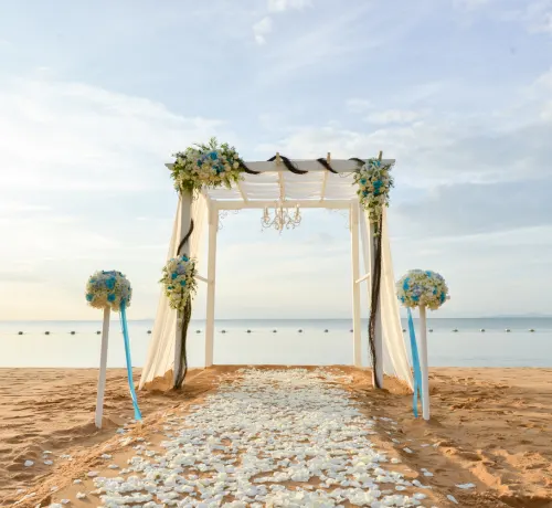 Beautiful beach wedding setup with elegant decor and ocean backdrop, highlighting Goa Celebrations' premium beach wedding services.