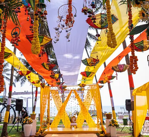 Traditional Haldi and Mehendi ceremony setup with vibrant decorations and cultural elements, offered by Goa Celebrations for memorable pre-wedding events.